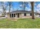 Charming single-story home with a stone facade and well-manicured front lawn at 5887 Meadowlark Dr, Indianapolis, IN 46226
