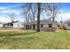 Lovely home with a neat lawn, complemented by large trees offering shade and curb appeal at 5887 Meadowlark Dr, Indianapolis, IN 46226