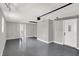 Large garage with painted floor, white walls and ceilings, and access door at 5887 Meadowlark Dr, Indianapolis, IN 46226