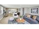 Open floor plan showcasing the living room, dining area, and kitchen with sleek finishes at 5887 Meadowlark Dr, Indianapolis, IN 46226