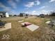 Fun community cornhole area with benches, perfect for outdoor games and gatherings at 6011 Card Blvd, Indianapolis, IN 46221