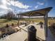 Community pavilion featuring picnic tables for outdoor dining and gathering in a well maintained common area at 6011 Card Blvd, Indianapolis, IN 46221