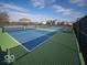 Well-maintained community tennis courts with blue and green surfaces, ready for friendly matches at 6011 Card Blvd, Indianapolis, IN 46221