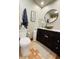 Modern bathroom featuring a stylish vanity with a unique vessel sink, toilet, and tiled floors at 611 N Park Ave # 405, Indianapolis, IN 46204