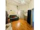 Charming Bedroom with hardwood floors, playful decor, daybed, and peaceful ambiance at 611 N Park Ave # 405, Indianapolis, IN 46204