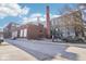 Exterior view showcasing the building's brick facade, smokestack, and architectural details at 611 N Park Ave # 405, Indianapolis, IN 46204