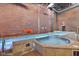 Indoor pool and jacuzzi area with tiled accents, offering a relaxing retreat for residents at 611 N Park Ave # 405, Indianapolis, IN 46204