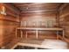 Relaxing wooden sauna with tiered seating, providing a tranquil space for unwinding and rejuvenation at 611 N Park Ave # 405, Indianapolis, IN 46204