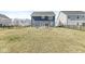 Spacious backyard featuring a well-maintained lawn and a charming two-story home at 629 Washington St, Fortville, IN 46040
