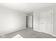 Bright bedroom with neutral carpet, white walls and trim, and paneled interior doors at 629 Washington St, Fortville, IN 46040