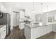 Gourmet kitchen boasts stainless appliances, granite countertops, and a large center island at 629 Washington St, Fortville, IN 46040