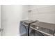 Laundry room featuring newer model appliances and wire shelving at 629 Washington St, Fortville, IN 46040