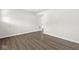 Open-concept living space with stylish hardwood floors, offering a versatile area for relaxation and entertainment at 629 Washington St, Fortville, IN 46040