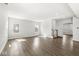 Spacious living room features hardwood floors, bright windows, and neutral walls at 629 Washington St, Fortville, IN 46040