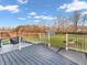 View of a backyard from the deck, with a wooden fence and blue shed at 6746 Wilmot Ln, Avon, IN 46123