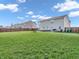 Spacious backyard with lush green grass, privacy fence, and inviting fire pit, great for outdoor enjoyment at 6746 Wilmot Ln, Avon, IN 46123