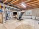 Large unfinished basement with exposed ceiling, concrete wall, and carpet, offering customization opportunities at 6746 Wilmot Ln, Avon, IN 46123