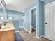 Bright bathroom featuring a double sink vanity, shower, and toilet area for added convenience at 6746 Wilmot Ln, Avon, IN 46123