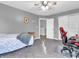 Bedroom with carpet, ceiling fan, a window, and a door leading to another room at 6746 Wilmot Ln, Avon, IN 46123