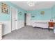 Bedroom with carpet, light aqua walls, a double door closet and white wainscoting at 6746 Wilmot Ln, Avon, IN 46123
