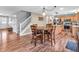 View of the dining area adjacent to the kitchen and front entry, with hardwood floors at 6746 Wilmot Ln, Avon, IN 46123
