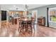 Dining area with a four seat table, stainless appliances, and access to the backyard at 6746 Wilmot Ln, Avon, IN 46123