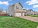 Beautiful two-story home with a well-maintained lawn and a two-car garage at 6746 Wilmot Ln, Avon, IN 46123