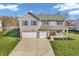 Aerial view of a two-story home with a two-car garage and well-kept lawn at 6746 Wilmot Ln, Avon, IN 46123