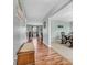 Inviting hallway with wood floors, leading to a dining area and living spaces, showcasing a seamless flow at 6746 Wilmot Ln, Avon, IN 46123