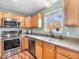 Modern kitchen featuring stainless appliances, neutral counter tops, and hardwood floors at 6746 Wilmot Ln, Avon, IN 46123