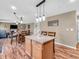 Kitchen island with an open floor plan into the living room and dining room at 6746 Wilmot Ln, Avon, IN 46123