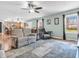 Bright living room featuring updated paint, window, neutral sofas, and hardwood floors at 6746 Wilmot Ln, Avon, IN 46123