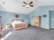 Bright and airy main bedroom featuring vaulted ceilings, a ceiling fan, and light blue walls at 6746 Wilmot Ln, Avon, IN 46123