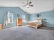 Spacious main bedroom boasting vaulted ceilings, natural light, and light blue walls at 6746 Wilmot Ln, Avon, IN 46123
