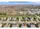 Aerial view of the neighborhood with neatly lined homes and lush greenery at 6746 Wilmot Ln, Avon, IN 46123