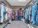 Spacious walk-in closet with ample shelving and storage space for clothes and accessories at 6746 Wilmot Ln, Avon, IN 46123