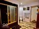 Bathroom featuring dark finishes, wooden flooring, and shower stall with glass door at 7154 S 325 W, Jamestown, IN 46147