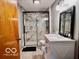 Updated bathroom featuring a sleek glass shower, white vanity and black fixtures at 7154 S 325 W, Jamestown, IN 46147