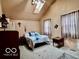 Comfortable bedroom with vaulted ceilings, skylight, carpet, and soft natural light at 7154 S 325 W, Jamestown, IN 46147
