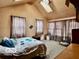 Bright bedroom features vaulted ceiling, skylight, and carpet at 7154 S 325 W, Jamestown, IN 46147