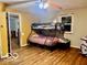 Bedroom featuring a bunk bed and view to the dining area at 7154 S 325 W, Jamestown, IN 46147