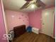 Bedroom featuring pink walls and a ceiling fan at 7154 S 325 W, Jamestown, IN 46147