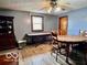 Open dining room with wood floors features a dining table, chairs, and a vintage display cabinet at 7154 S 325 W, Jamestown, IN 46147