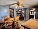 Open concept dining room has wood floors and features dining table, chairs, and doorway to kitchen at 7154 S 325 W, Jamestown, IN 46147