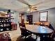 Traditional dining room has a ceiling fan, wood floors, and a large wood table with chairs at 7154 S 325 W, Jamestown, IN 46147
