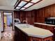 Traditional kitchen features wood cabinets, laminate countertops, and a large island with a sink at 7154 S 325 W, Jamestown, IN 46147
