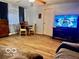 The living room has wood floors and a ceiling fan at 7154 S 325 W, Jamestown, IN 46147