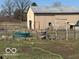 View of metal outbuilding with a fenced in yard and open doorway for storage and access at 7154 S 325 W, Jamestown, IN 46147