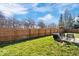 Well-maintained backyard with a lush lawn, patio set and a wooden privacy fence at 7260 Blue Ridge Dr, Noblesville, IN 46062