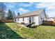 Spacious backyard with a well-maintained lawn, patio seating, and a secure wooden fence for privacy at 7260 Blue Ridge Dr, Noblesville, IN 46062